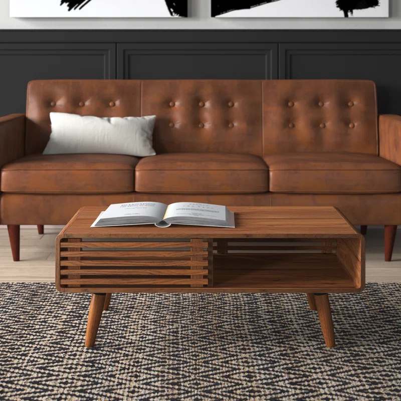 Contemporary wood coffee table featuring a natural finish and geometric design.