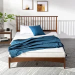 Elegant single bed in a minimalist bedroom setup.